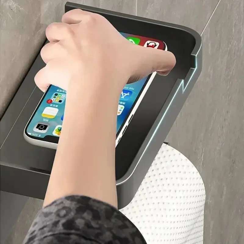 Wall-mounted toilet paper holder with a shelf on top