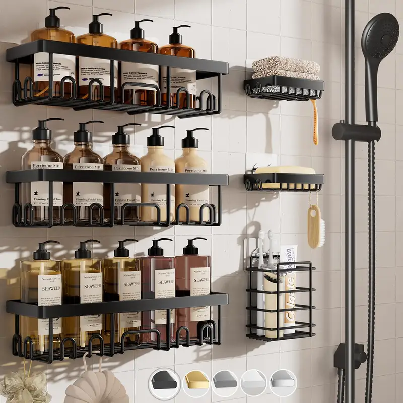 Gold stainless steel adhesive shower shelves on a bathroom wall