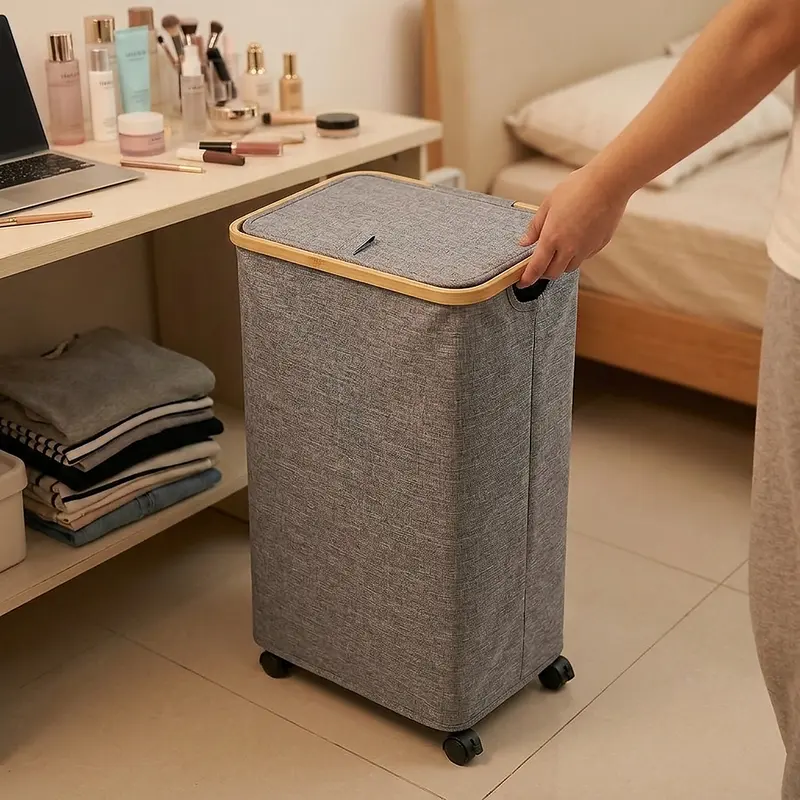Slim rolling laundry hamper with a lid beside a washing machine