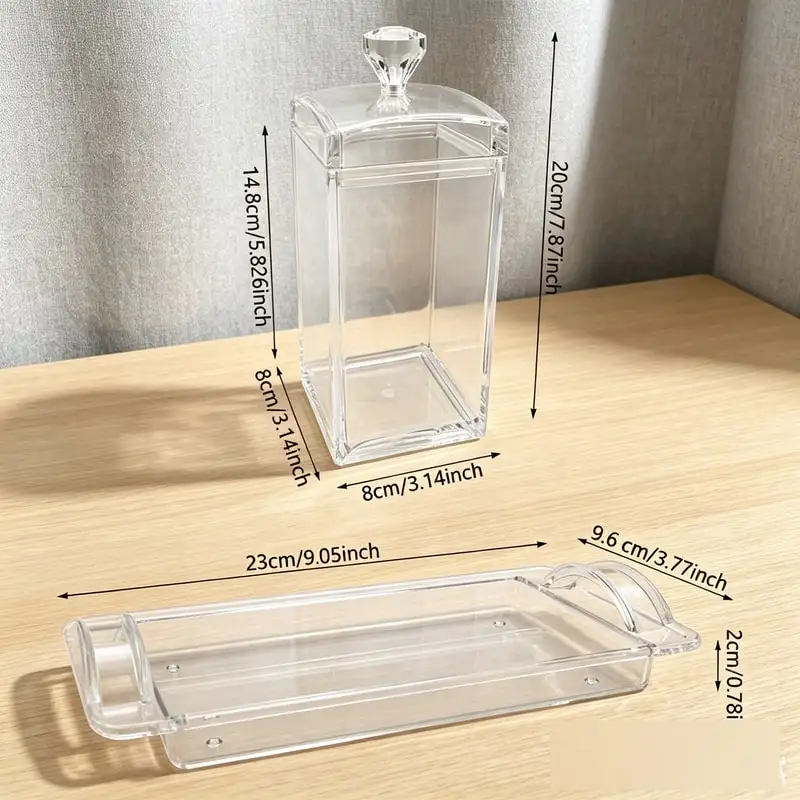 Two clear square acrylic canisters stacked with snacks inside
