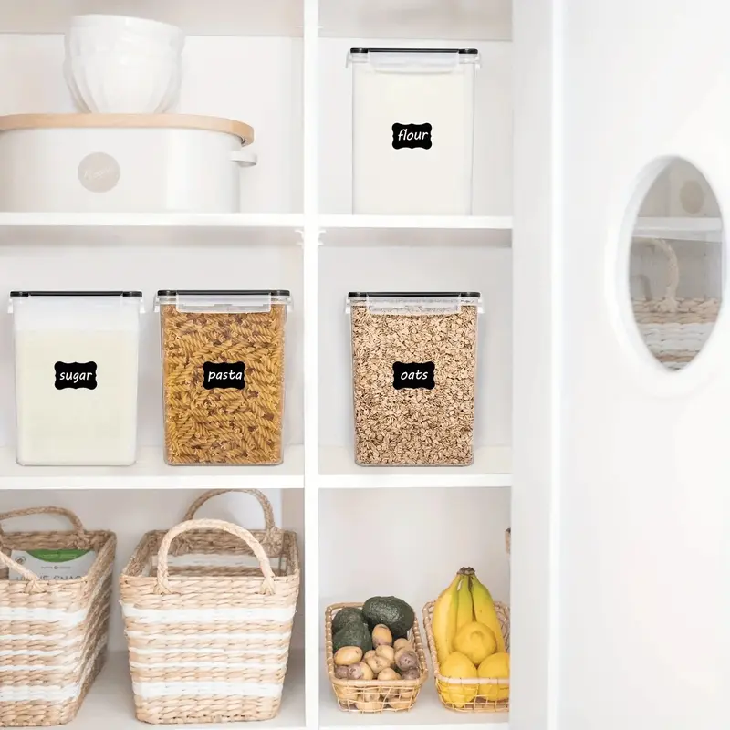 Four large rectangular plastic food storage bins with labels