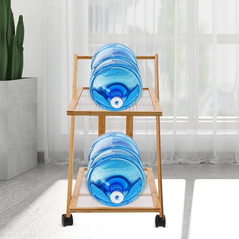 Two-tier folding bamboo cart with books beside a sofa