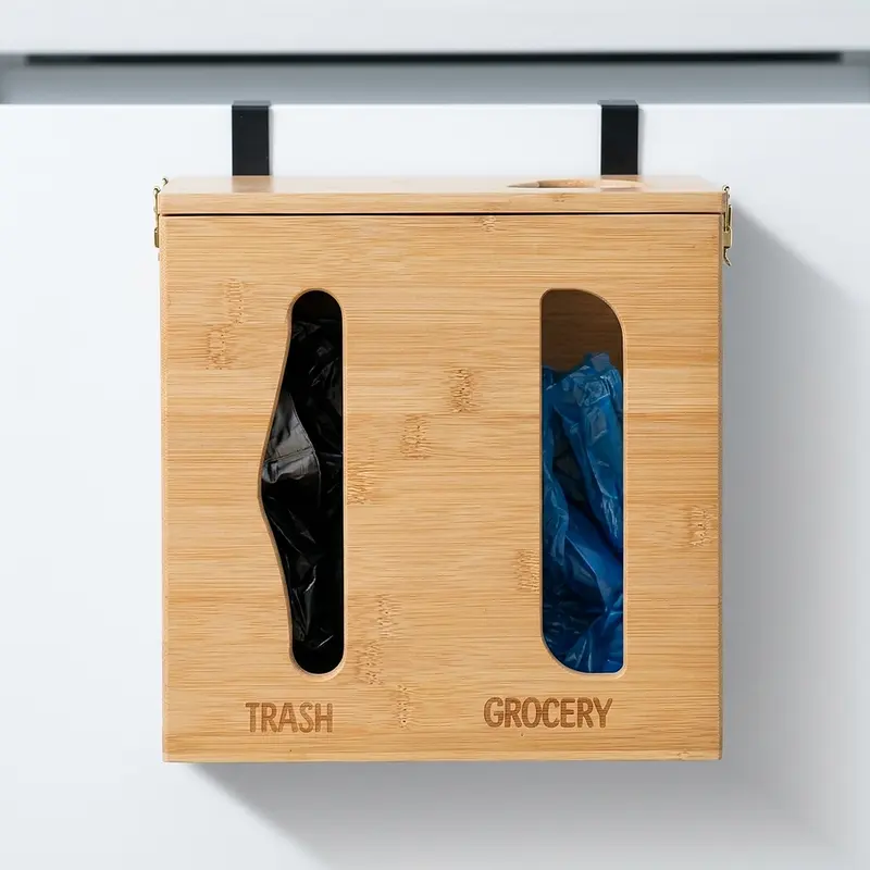 Bamboo trash bag dispenser hanging on a cabinet door