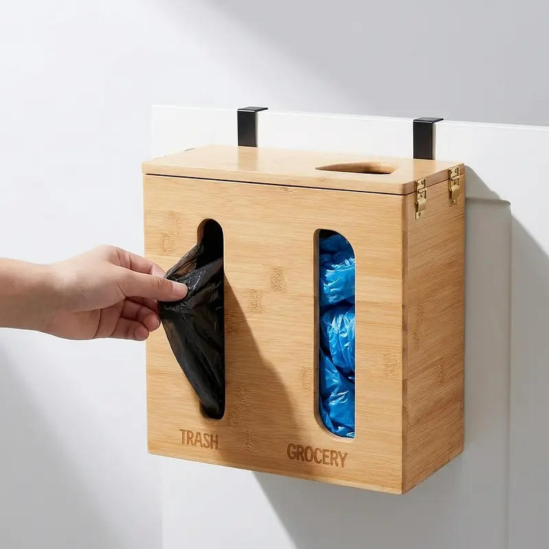 Bamboo trash bag dispenser hanging on a cabinet door