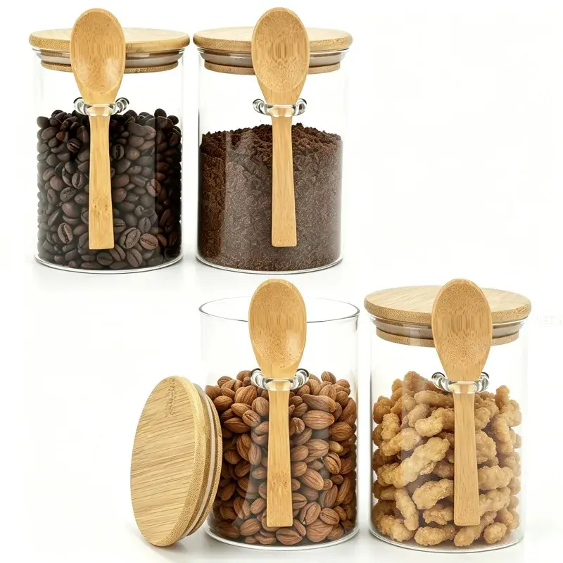 Two glass jars with wooden spoons and lids