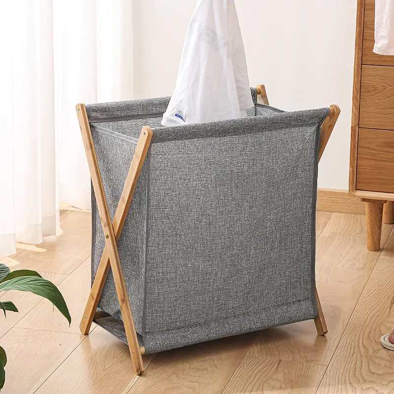 Foldable bamboo laundry hamper with a fabric bag