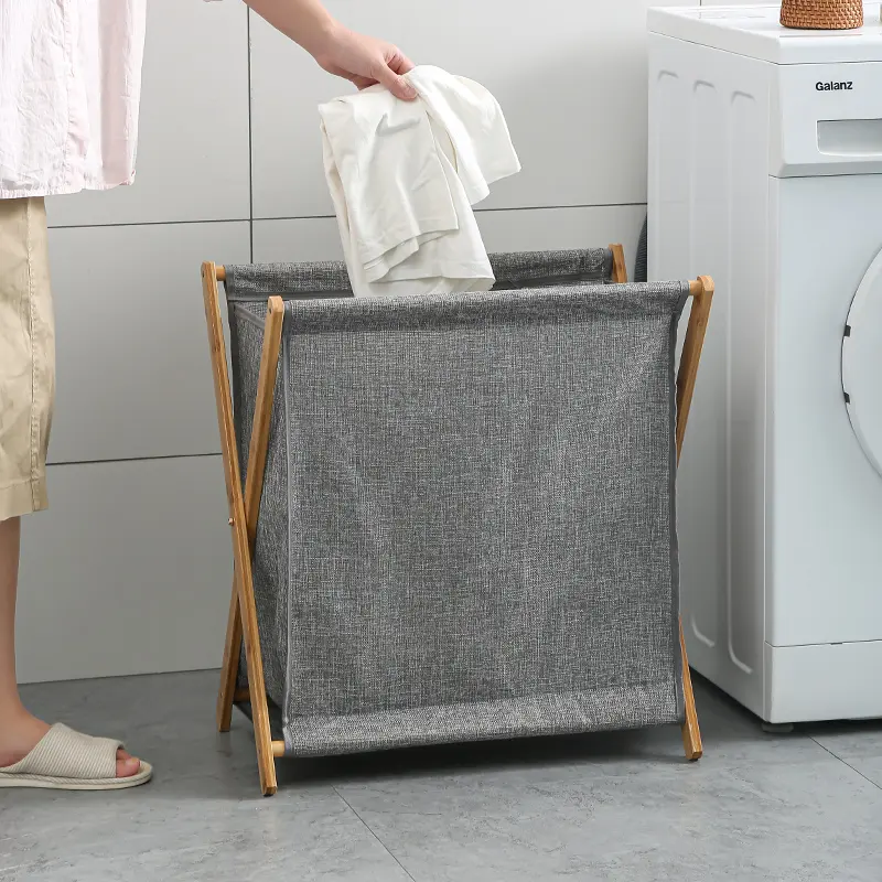 Foldable bamboo laundry hamper with a fabric bag