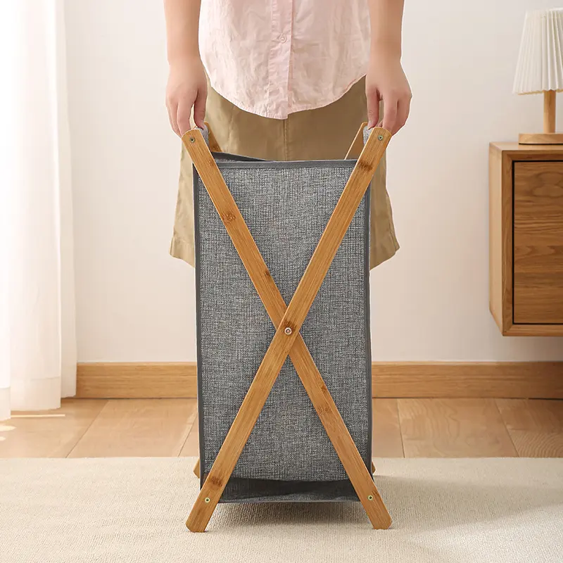 Foldable bamboo laundry hamper with a fabric bag