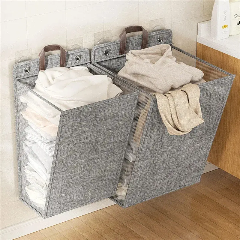 Gray foldable laundry hamper hanging on a bathroom wall