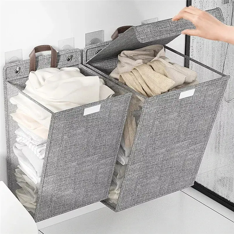 Gray foldable laundry hamper hanging on a bathroom wall