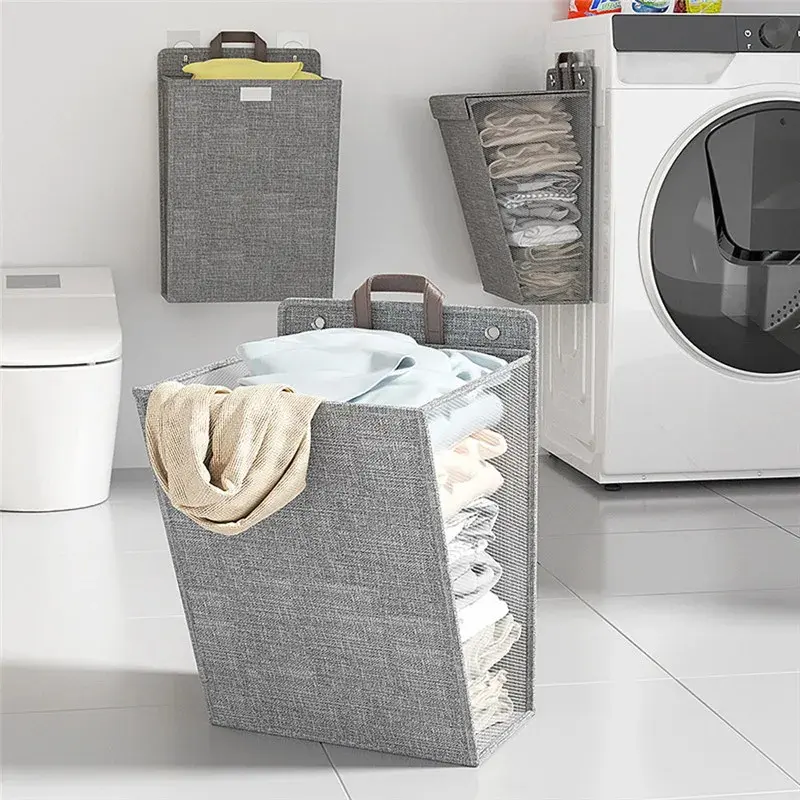 Gray foldable laundry hamper hanging on a bathroom wall