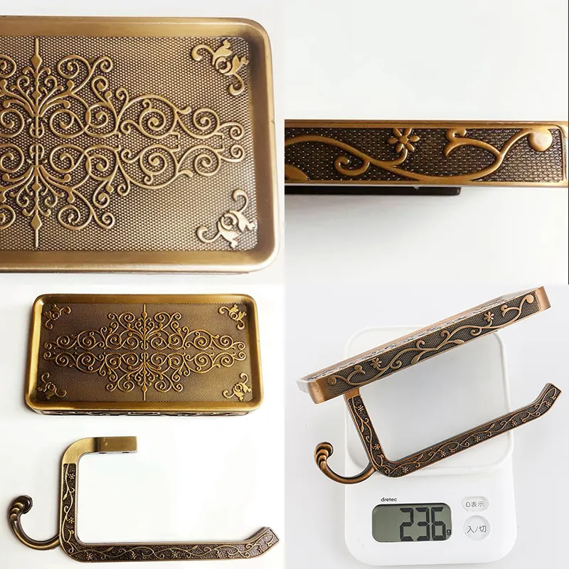 Antique bronze carved toilet paper holder with a phone shelf