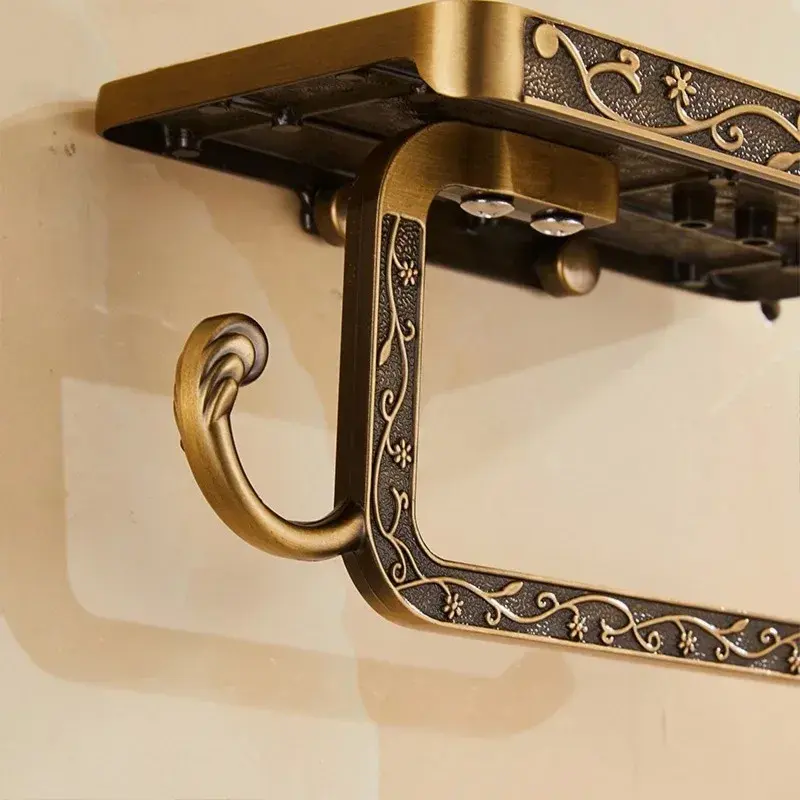 Black carved toilet paper holder with a phone shelf