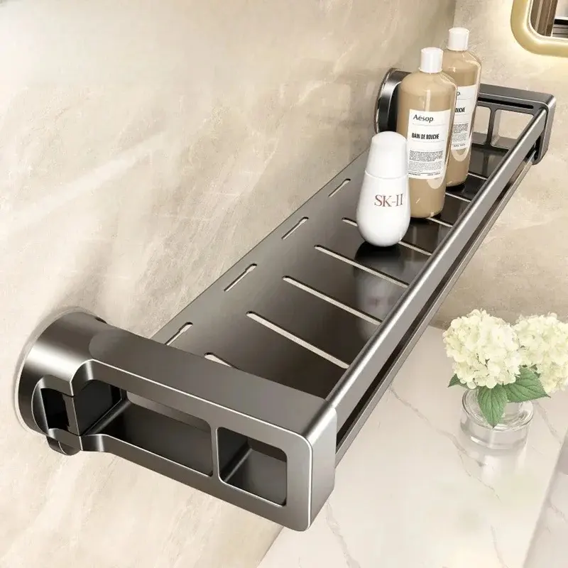 Grey aluminum shower basket on suction cups with bottles