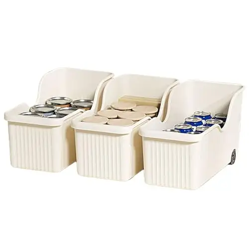 Beige plastic pull-out bins on wheels in an under-sink cabinet
