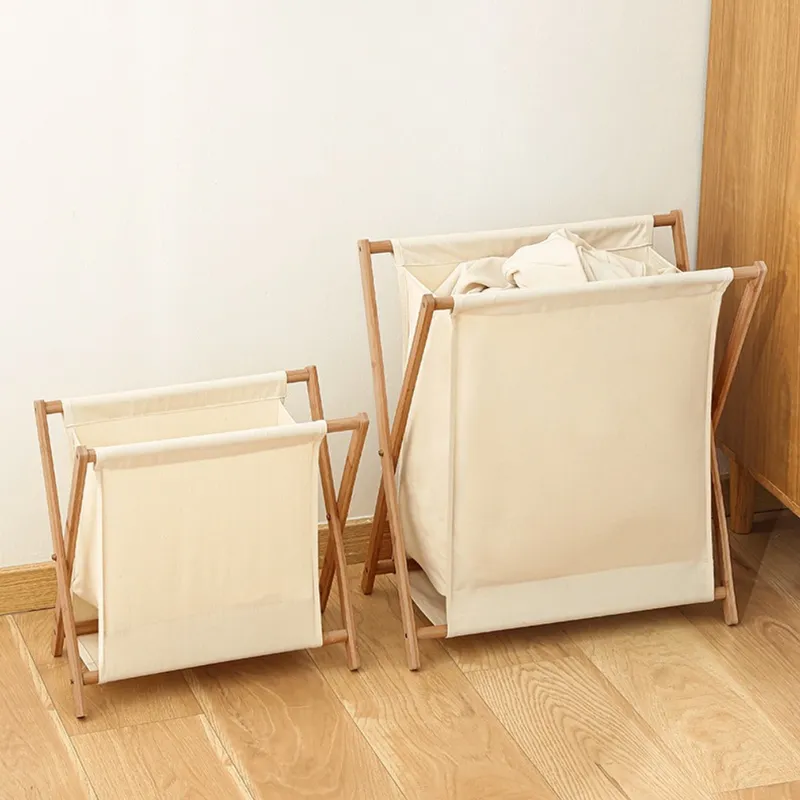Small gray foldable laundry basket with a wooden frame