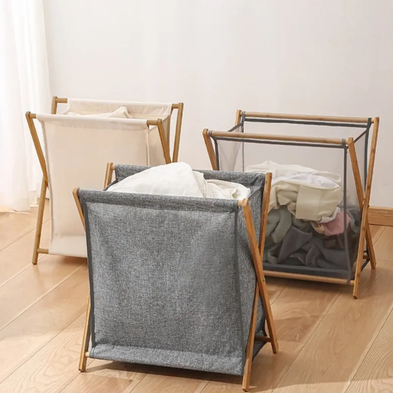 Small gray foldable laundry basket with a wooden frame
