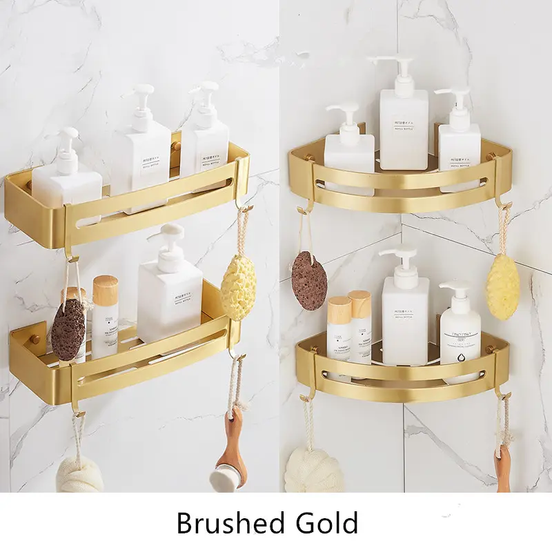 Brushed gold corner shelves holding shampoo bottles