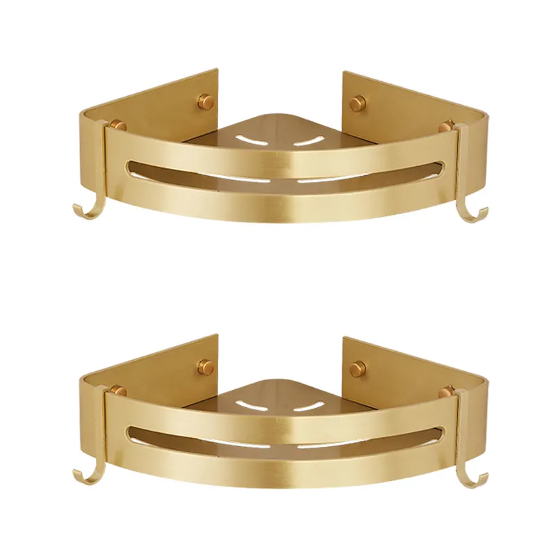 Brushed gold corner shelves holding shampoo bottles