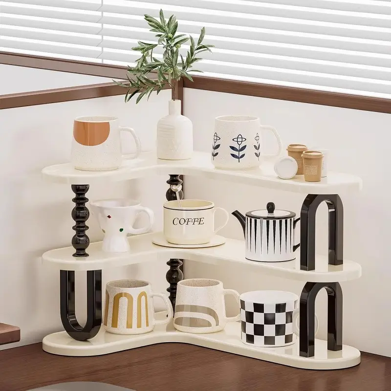 White curved three-tier shelf holding cups and coffee jars