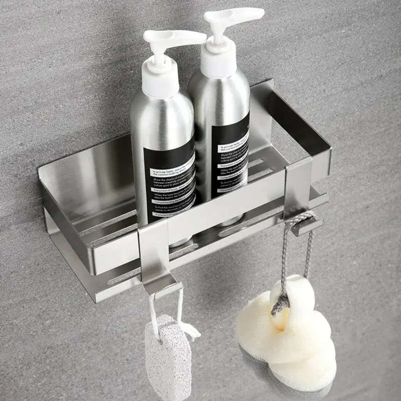 Silver stainless steel shower basket with hooks on a wall