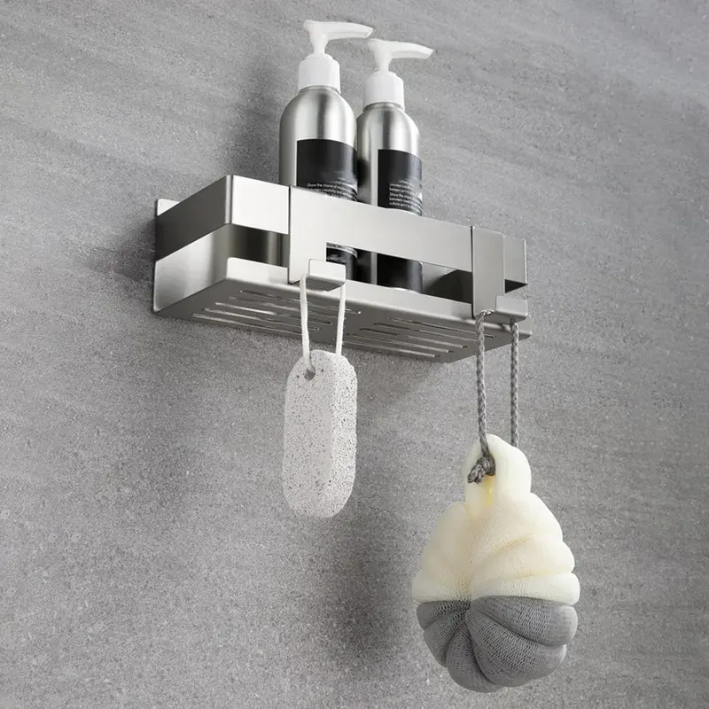 Silver stainless steel shower basket with hooks on a wall