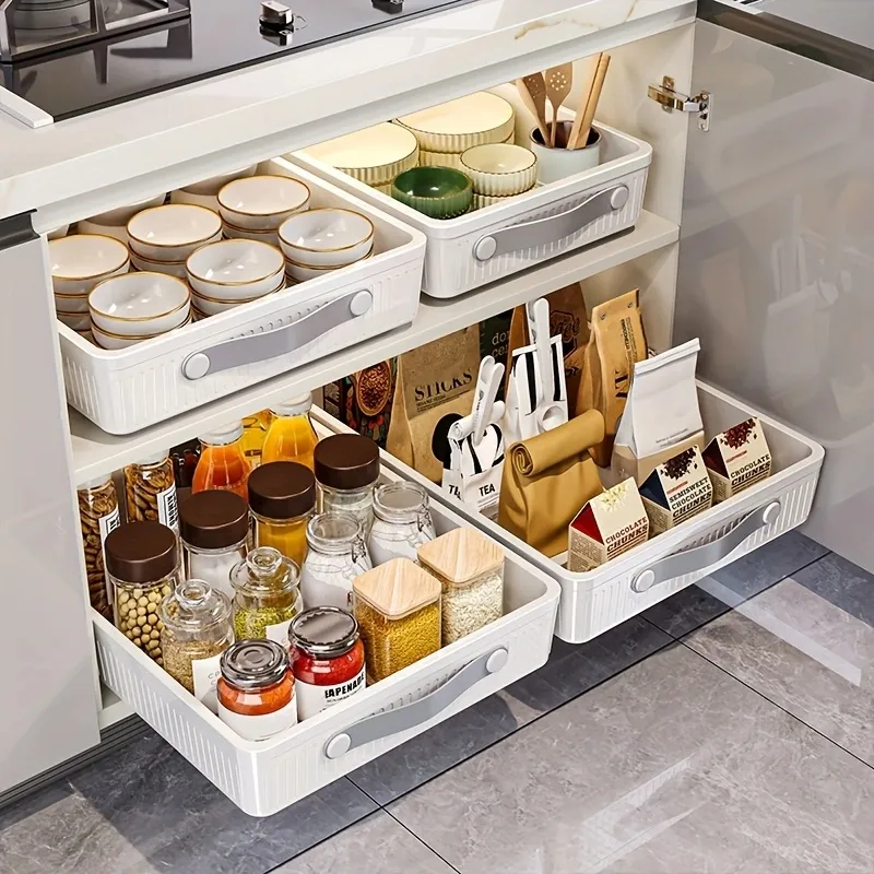 Large pull-out plastic basket in a kitchen cabinet