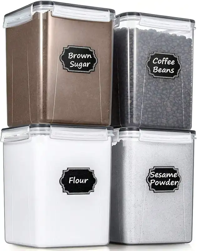 Four large airtight plastic flour containers with labels