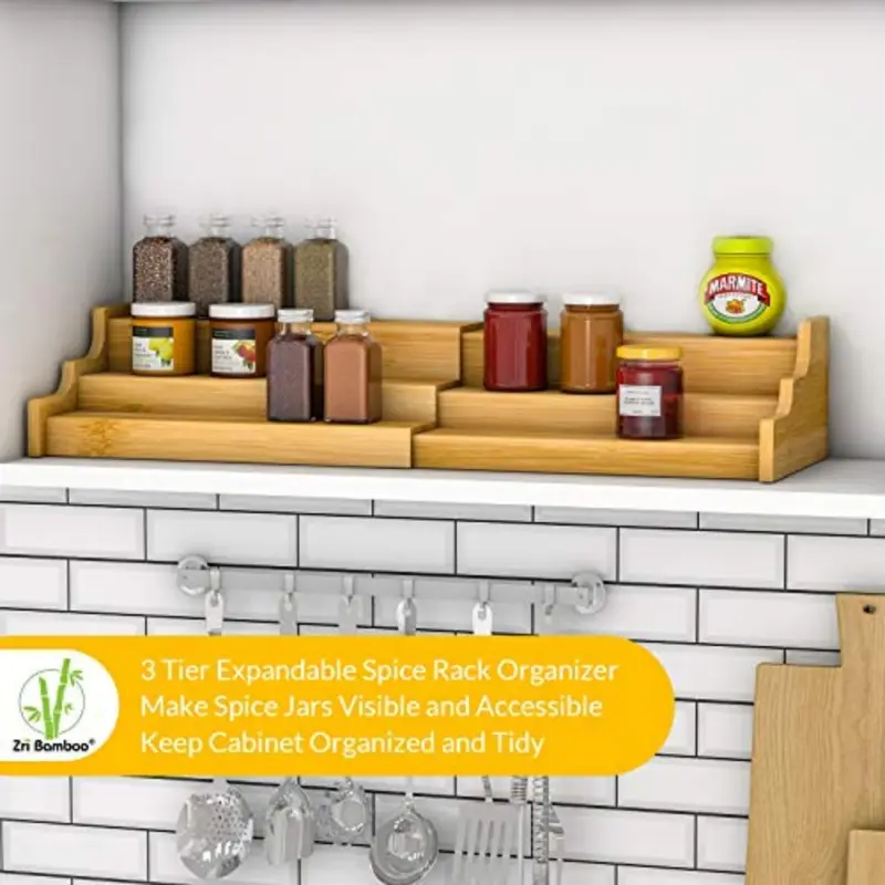 Three-tier expandable bamboo spice rack holding jars