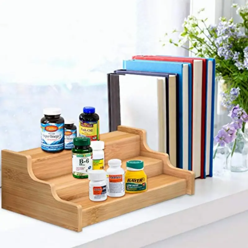 Three-tier expandable bamboo spice rack holding jars